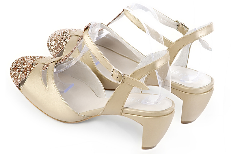 Gold women's open back T-strap shoes. Round toe. Medium comma heels. Rear view - Florence KOOIJMAN